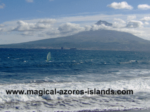 A windsurfer in Faial, Pico in the background